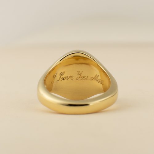 Engraving under the head of signet ring.