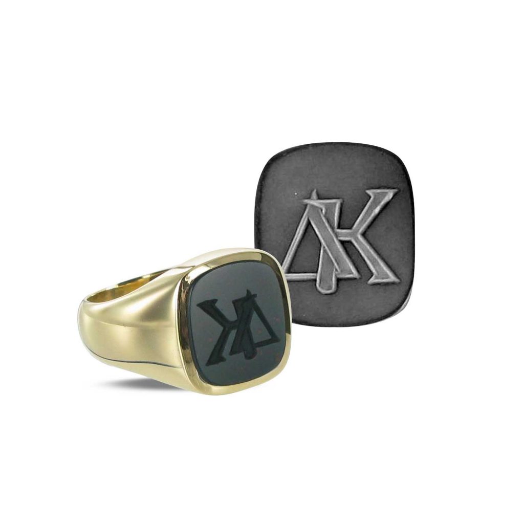 Cushion shaped signet ring, seal engraved with a monogram design